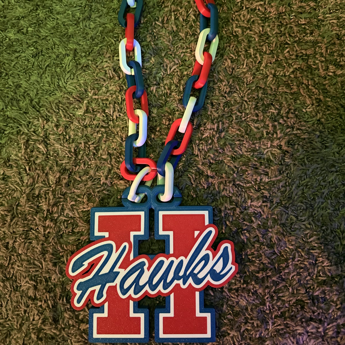 Red, white and blue Hays Hawks fan chain with a large H pendant and Hawks script across the front.
